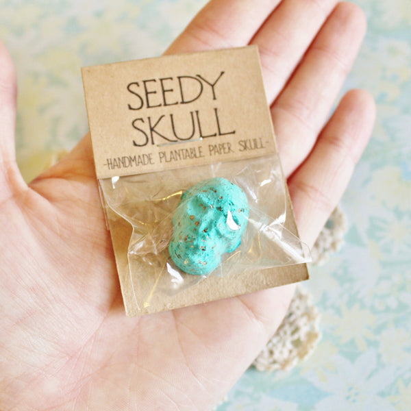 Single Teal Blue Plantable Paper Seedy Skull. Wildflowers